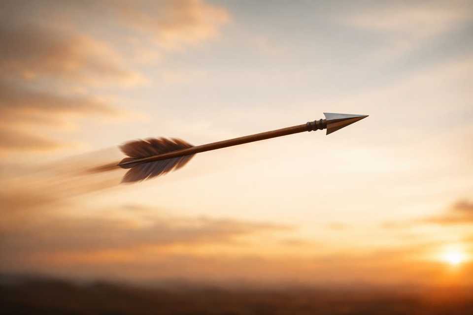 An arrow mid-flight against a sunset sky